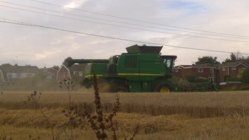 Picture of a combine harvester at work