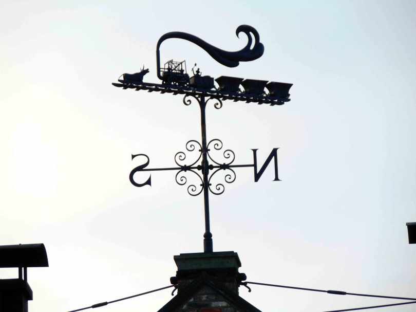 Picture of a fancy weather vane atop a building at Beamish Meuseum