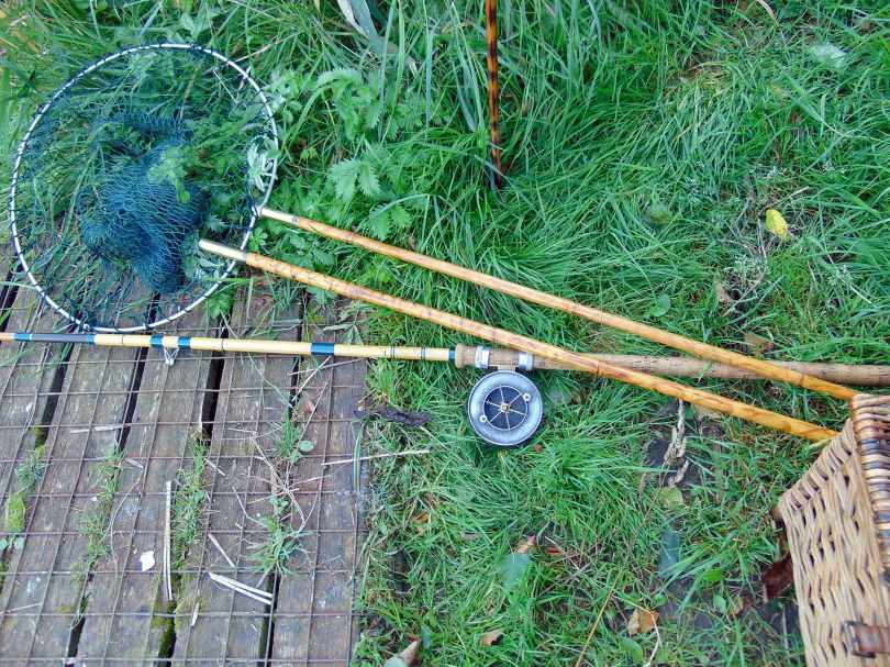 Picture of an Edgar Sealey fishing rod, vintage landing net and wicker creel
